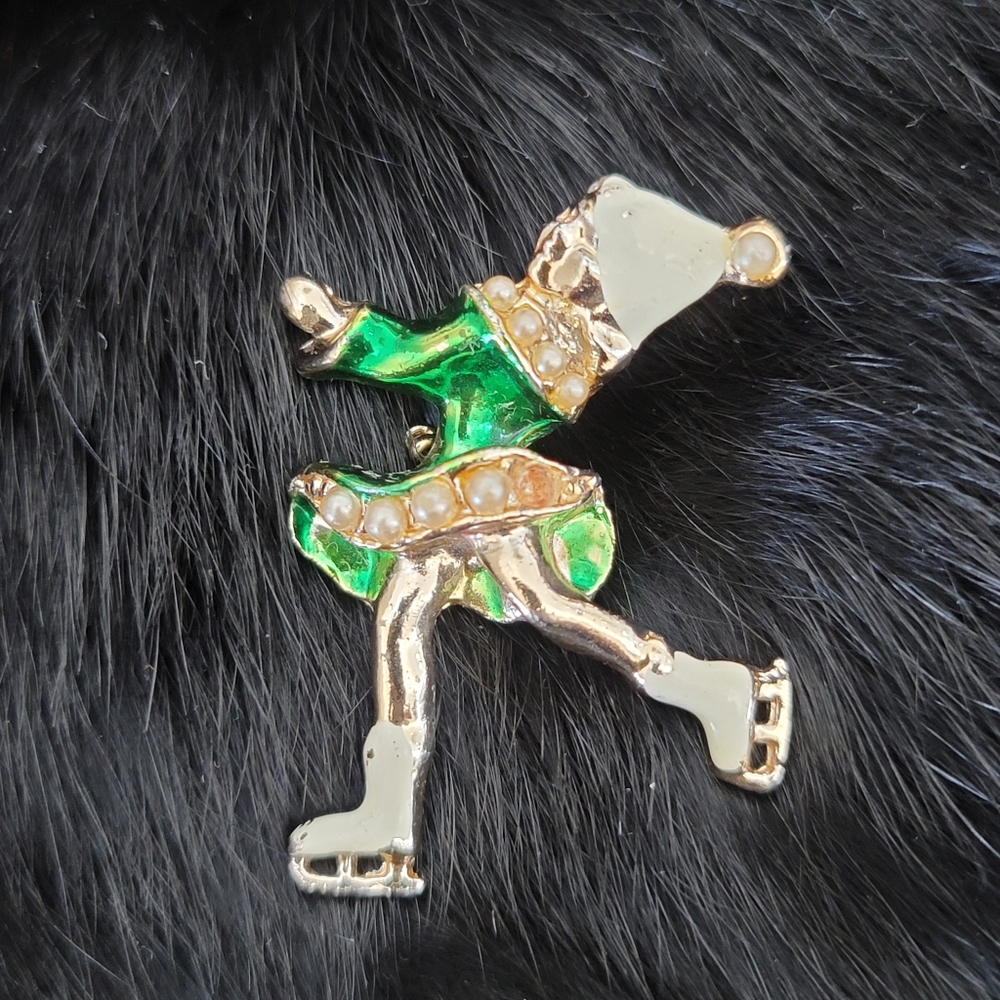 Vintage ice skating girl with pearls brooch
